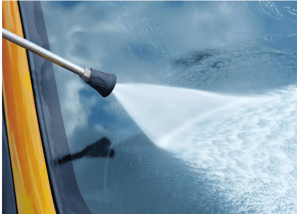 Power washing a glass surface