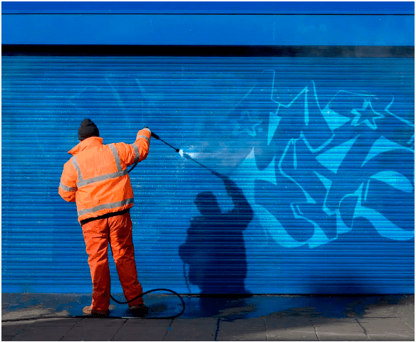 Cleaning graffiti with high-pressure hose