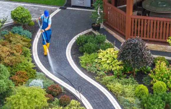 Person cleaning curved walkway