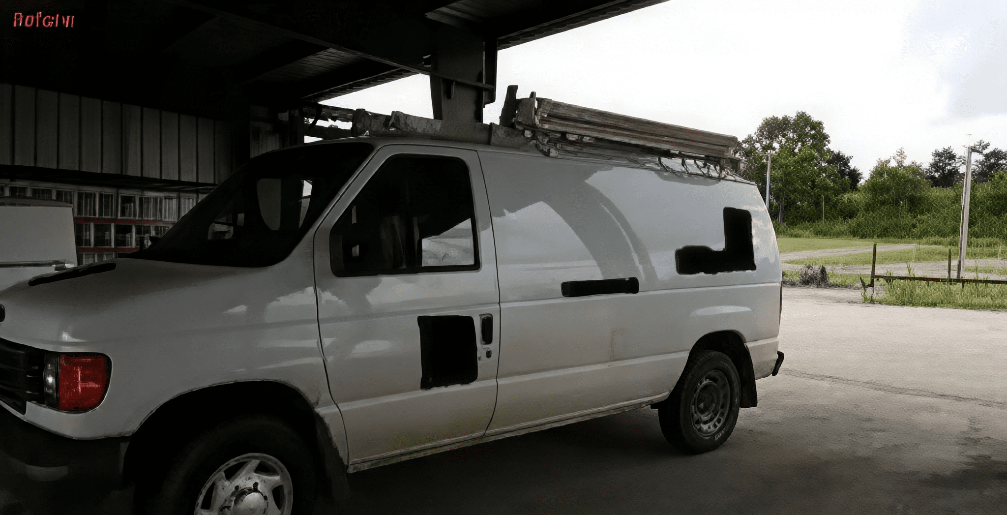 White van parked in a garage