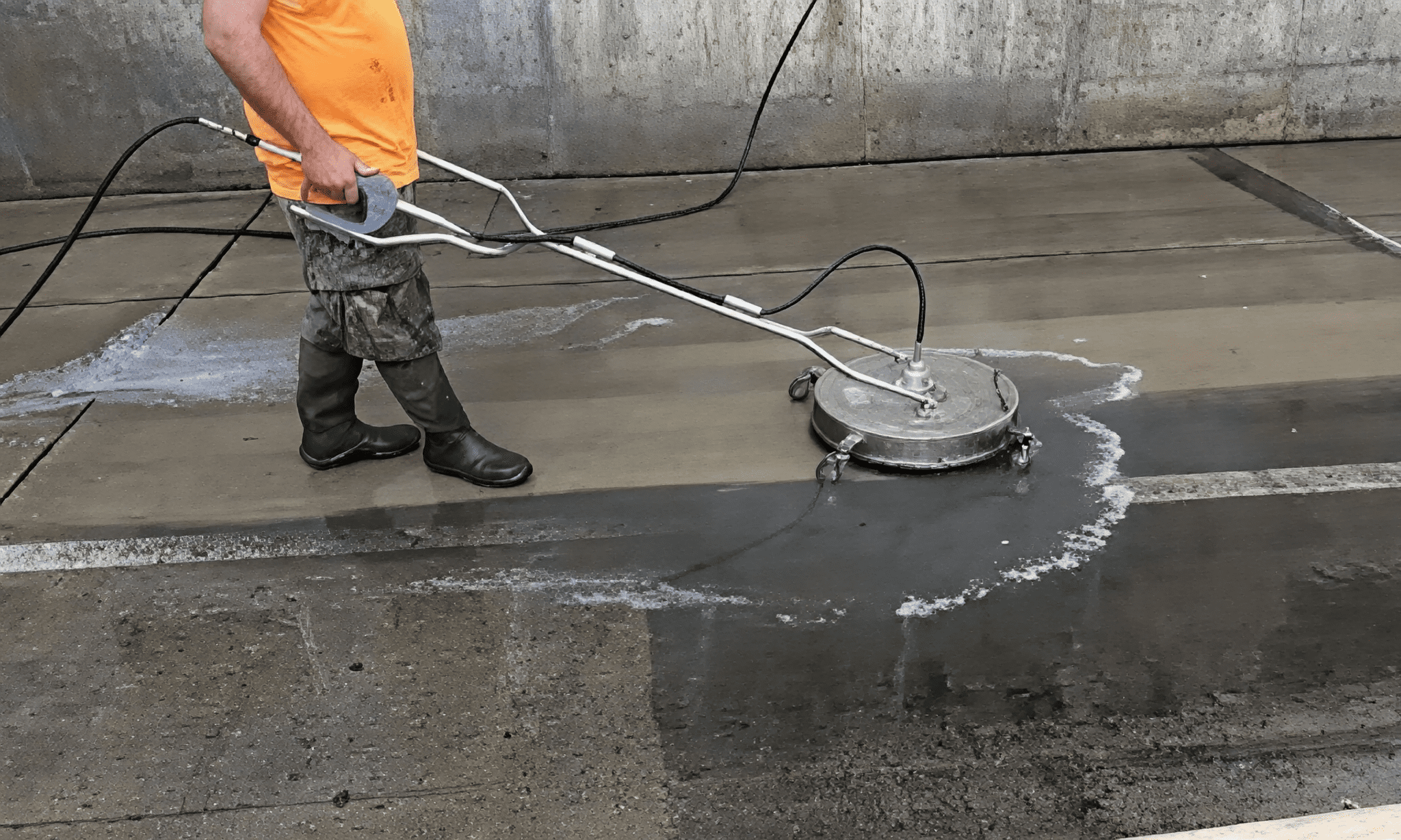 Outdoor concrete cleaning using power equipment