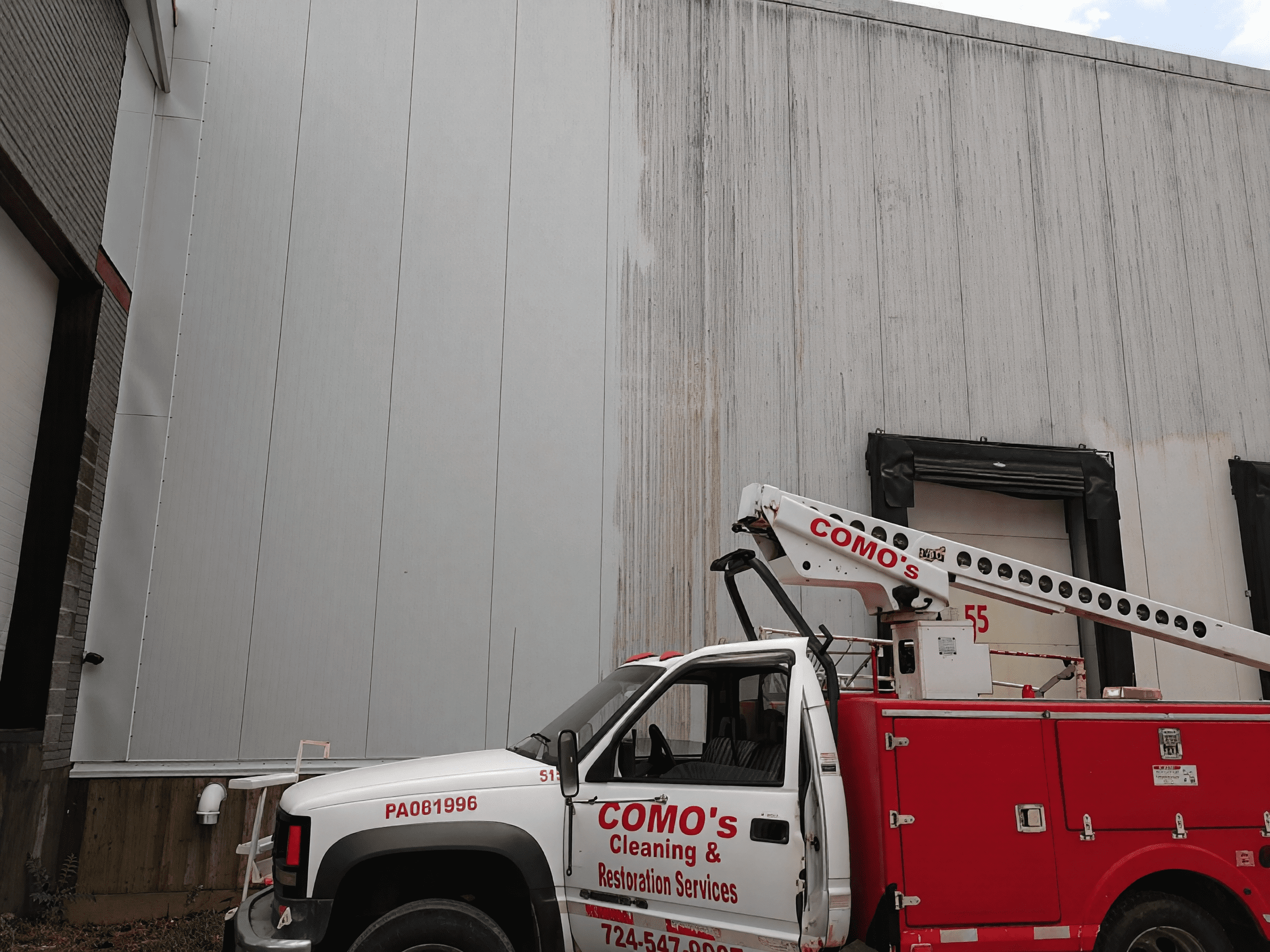 Industrial cleaning service vehicle parked outside