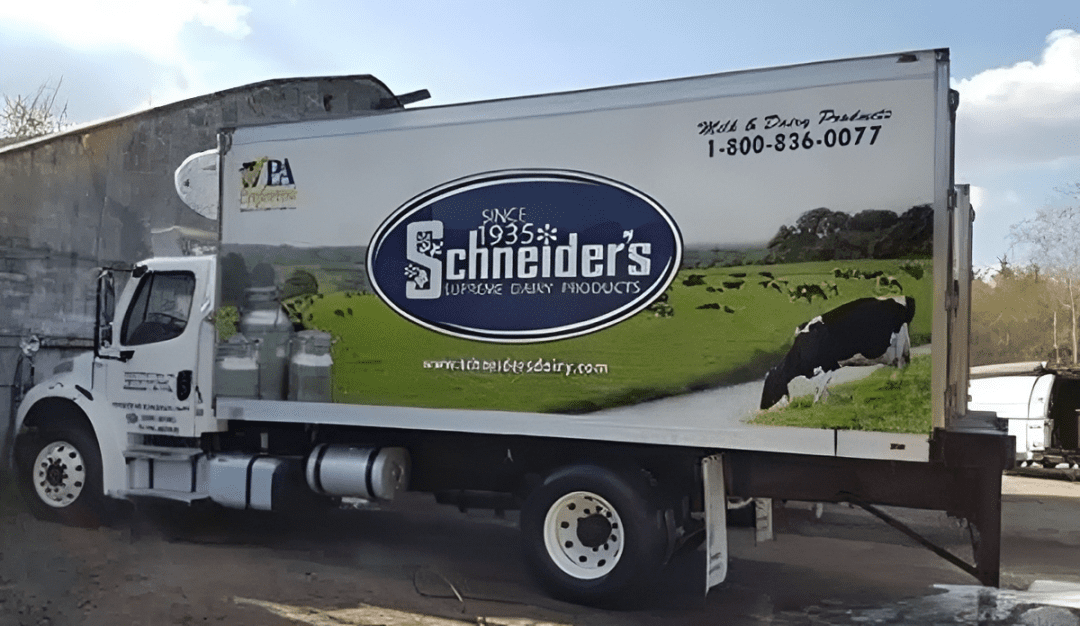 Schneider's Dairy truck with countryside image