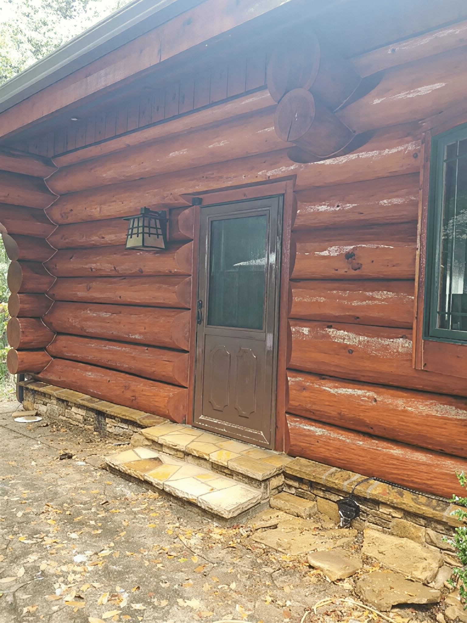 Wooden cabin with lantern above door