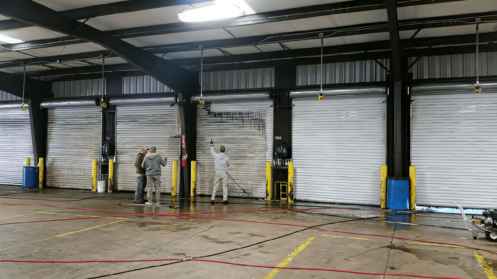 Industrial garage doors being maintained