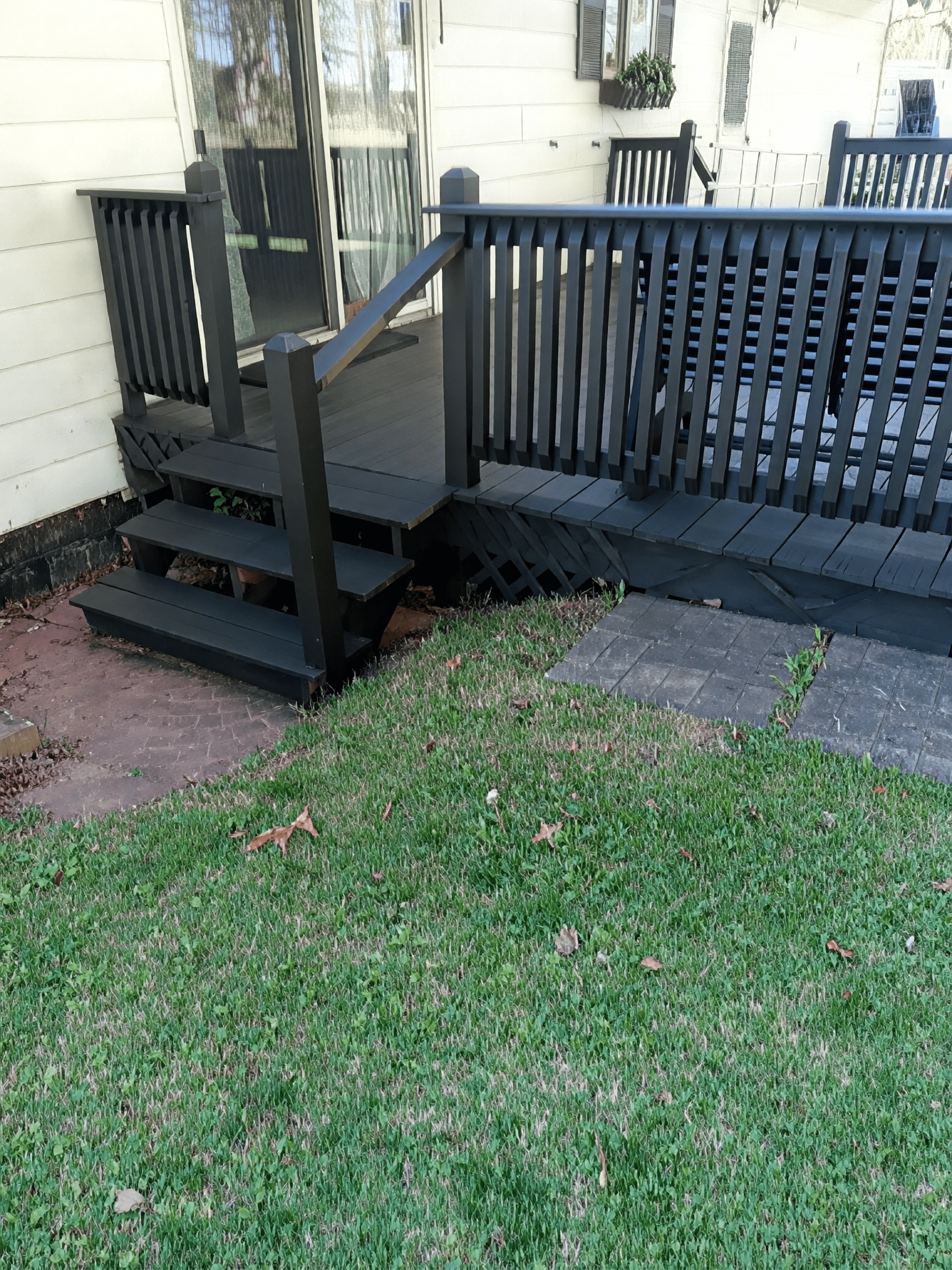 Wooden deck with steps and grass